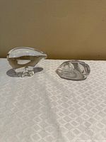 Both Spode clear glass paperweights side by side