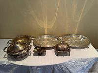 All six silver-plated pieces grouped on table