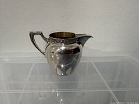 Front view of .800 silver creamer
