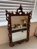 Front view of ornate Durwood mirror