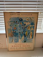 Full view of framed poster showing artwork and text