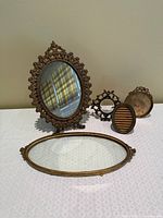 Front view showing all five brass items grouped together