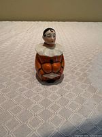 Front view of porcelain clown perfume bottle