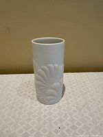 Front view of cylindrical white porcelain vase