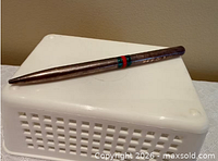 Full view of pen lying on its side
