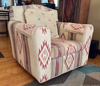 Front angle of armchair showing pattern and pillow