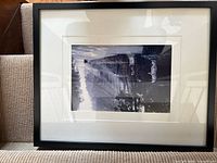 Black framed black-and-white photograph on stair