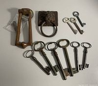 Overall group view: skeleton keys, door knocker, lion head horse tie