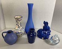 Group shot of all six decorative blue items