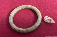 jade bangle and carved brooch front view