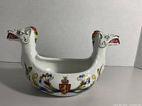 Side view showing both dragon heads and painted motifs