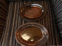 Both oval trays showing rims and general appearance