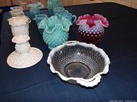 Group view showing assorted hobnail glass pieces, colors and forms