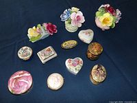 Group shot of eight pillboxes and three floral bouquets