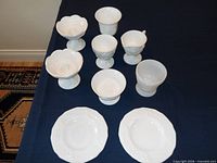 Group shot of all ten white milk glass pieces