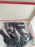 Scarf folded in striped Holt Renfrew box