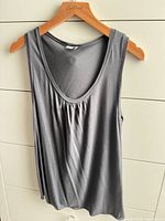 full front view of gray tank on hanger