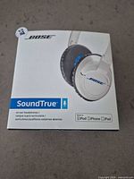 Front of retail box showing Bose SoundTrue headphones image and branding