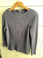 Front view of Giorgio Armani charcoal textured knit sweater on hanger
