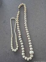 Both necklaces side by side showing lengths and bead styles