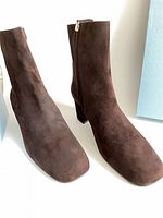 Both brown suede ankle boots side view showing uppers and heel shape