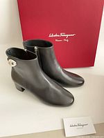 full view ankle boots, box, authenticity card visible