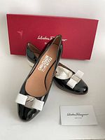 Top view of both shoes with box and card