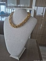 Necklace displayed on bust showing overall style and thickness
