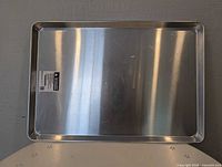 Top view of one aluminum baking sheet showing size and surface