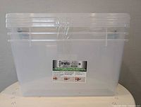 Front view of stacked InstaView 45 clear storage bin showing label