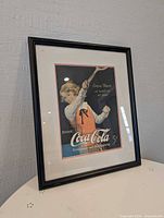 Framed Coca-Cola advertisement front view