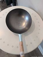 Top view of carbon steel wok showing interior finish