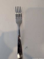 Single Tramontina stainless steel fork front view