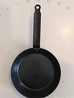 Top view of black steel frying pan