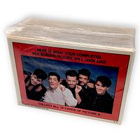 Factory-wrapped stack of cards showing completed red border picture reference