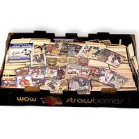 Overview of box showing loose stacks of hockey cards, autographed cards in sleeves and player coins