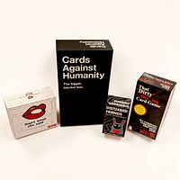 Front view of four boxed adult party card games