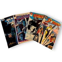 Front covers of the four comic books fanned out showing titles and cover art