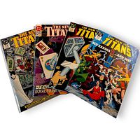 Four of the five comic books fanned out, showing front covers and titles