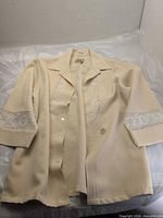 Front view of cream Hawaiian shirt with lace panels