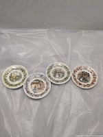 Front view of four Brambly Hedge saucers