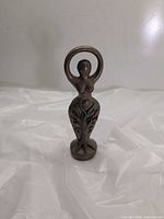 Front view showing tree motif and crescent moon