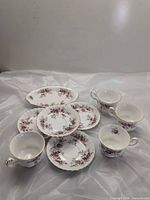 Group of Royal Albert Lavender Rose teacups, saucers, side plate, sugar bowl and oval platter
