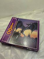 Front of sealed jigsaw puzzle box showing dragon artwork and 1500-piece count