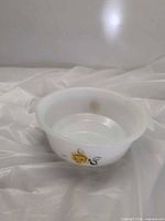 Side view showing bowl, handles, yellow rose decal