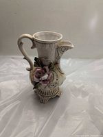 Front view showing floral applique and ornate design