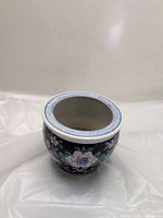 Overall view of porcelain pot showing floral design and rim