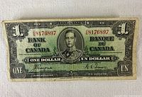 Obverse of 1937 Bank of Canada $1 note showing King George VI portrait, denomination, serial number and signatures