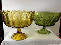 Amber and avocado pedestal bowls side by side