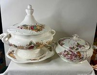 Both tureens side by side showing size comparison and designs